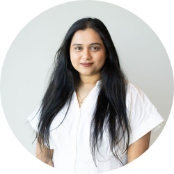 Uma Chowdhury, Claims Team Lead, at BerkleyNet smiling, as they share about their positive experience having a career in workers compensation insurance. 